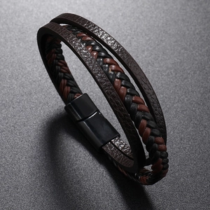 Close-up of triple-layered woven leather bracelet with black matte magnetic buckle clasp