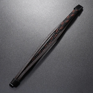 Detail of multi-layer braided leather bracelet with black matte metal clasp and buckle
