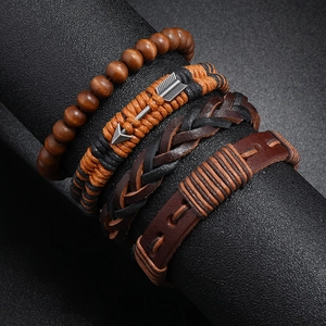 Detailed view of 4-piece vintage leather bracelet set with wooden beads and metal arrows
