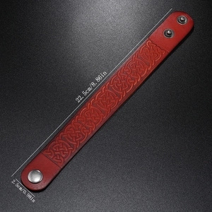 Detail of Celtic knot embossed leather bracelet showing 22.5cm length and snap closure