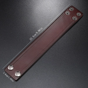 Detail view of brown wide leather bracelet showing double snap buttons and dimensions
