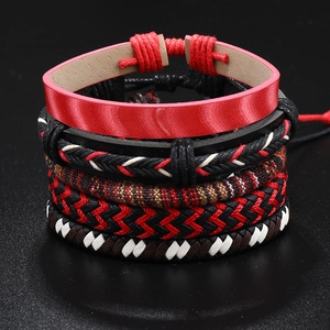 Detailed view of handmade bohemian multi-layer braided leather bracelets in red and black