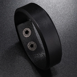 Macro side view of black wide leather bracelet with dual metallic button snaps