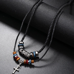 Vintage multilayer beaded leather necklace with a metallic cross pendant and boho style