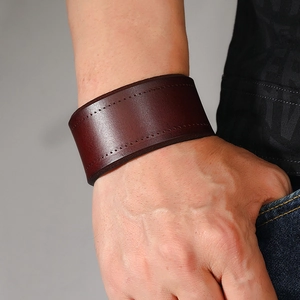 Men's wide brown leather bracelet with parallel stitching in punk vintage style