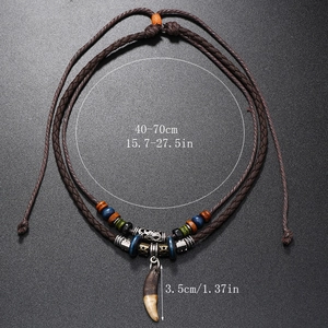 Vintage boho faux tooth pendant on brown braided leather cord with colorful beads
