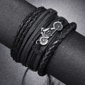 Multi-layer black braided leather bracelet featuring a vintage silver motorcycle charm