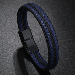 Macro detail of navy blue and black braided leather bracelet with black magnetic clasp