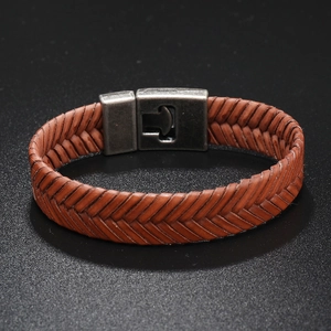 Close-up of brown braided leather bracelet with vintage silver magnetic clasp