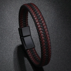 Detail of red and black braided leather bracelet with matte black magnetic clasp