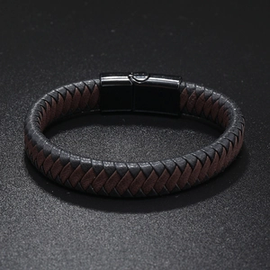 Detail of multi-layer woven leather bracelet for men with a polished black metal magnetic clasp