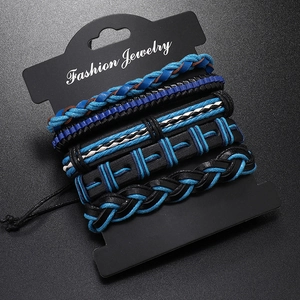 Macro detail of men's five-piece braided leather bracelet set in blue and black