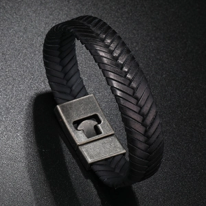 Detailed macro view of black braided leather men bracelet with vintage magnetic clasp