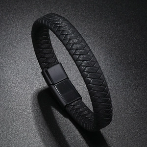 Close-up of black braided leather bracelet featuring a polished magnetic metal clasp