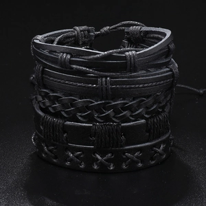 Close-up of a 5-piece set of handmade black braided leather bracelets with adjustable ropes
