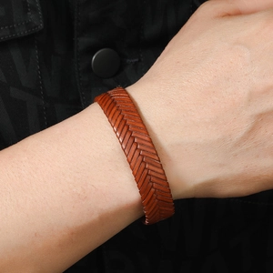 Retro brown braided leather bracelet for men featuring a classic herringbone weave style
