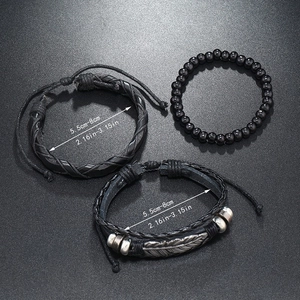 Detail view of 3-piece men's leather bracelets with bead and silver feather pendant