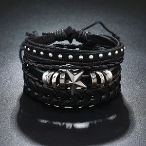Detail view of multi-layer leather bracelet set with woven ropes and vintage metal star