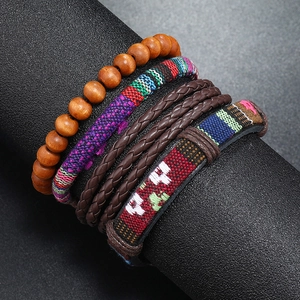 Handmade bohemian leather bracelet set with wooden beads and tribal patterns