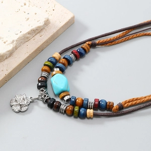 Bohemian multilayer necklace with turquoise, colorful beads and silver flower pendant