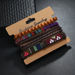 Detail of 5-piece handmade braided leather and beaded ethnic style bracelet set
