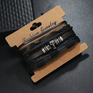 Three-piece multi-layer black leather bracelet set with vintage silver skull charms