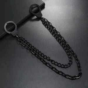 Detailed view of matte black metal double chain belt with handcuffs for punk style