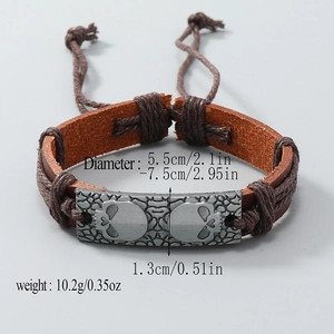 Handmade woven leather bracelet with vintage bronze skull charms and adjustable cord strap