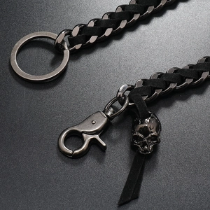 Punk style gunmetal waist chain with black leather braid and detailed skull charm