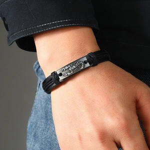 Men's handmade woven black leather bracelet featuring a vintage alloy scorpion charm