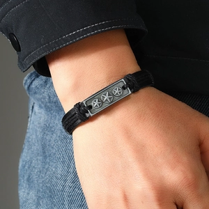 Vintage braided leather bracelet for men featuring stars on a metal plaque on wrist