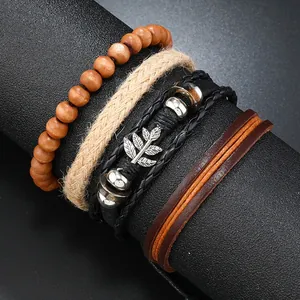 Macro detail of handmade braided leather bracelets and wood beads on a display stand