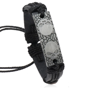 Handwoven black leather punk bracelet with silver skull metal plate and adjustable cord