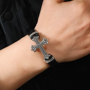 Gothic silver cross braided leather bracelet for men featuring a magnetic metal clasp