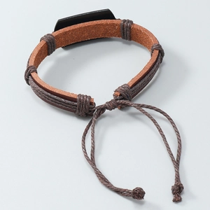 Detail of hand-woven brown leather bracelet with black rectangle plate and adjustable drawstring