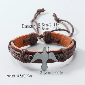 Handmade woven brown leather bracelet with silver bird pendant and adjustable strap