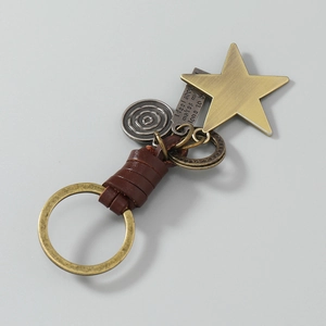 Vintage braided leather keychain with bronze star pendant and engraved metal tags
