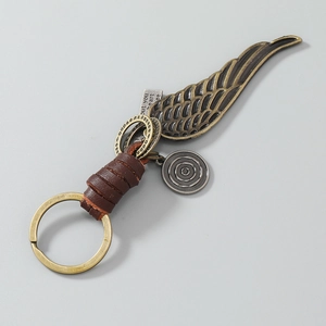 Vintage leather braided keychain with bronze wings and engraved heart pendant