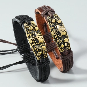 Woven leather bracelets featuring vintage alloy skull charms and adjustable cord