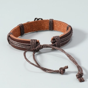 Handmade woven brown leather bracelet for men with adjustable cord in vintage beach style