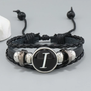 Detail of multi-layer leather bracelet with silver beads and letter I charm