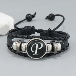Detail of multi-layer braided leather bracelet with letter P glass charm and metal beads