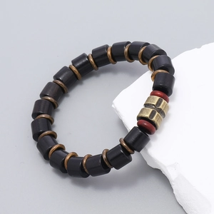 Retro handmade black wood beaded bracelet with vintage bronze accents and red beads