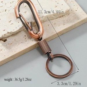 Vintage copper-tone alloy car keychain with spring clip and carabiner hook for men