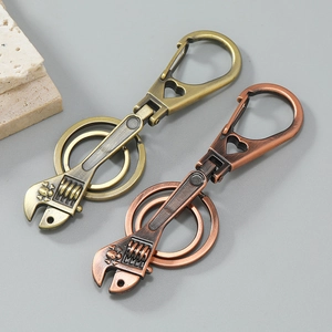 Industrial vintage wrench keychains in bronze and red copper finishes with double rings
