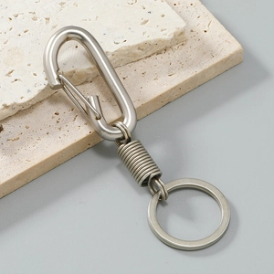 Close-up of vintage alloy key chain with durable spring carabiner and wire-wrapped detail