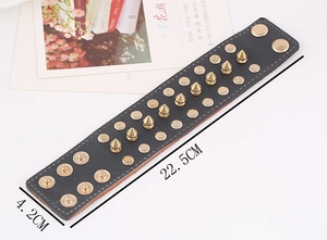 Punk rock wide black leather bracelet with three rows of gold metal studs and spikes