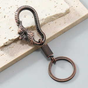 Retro dragon head alloy keychain with vintage bronze finish and secure ring loop
