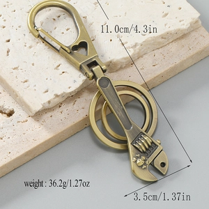 Vintage bronze wrench keychain with skull pattern and 11cm length dimensions