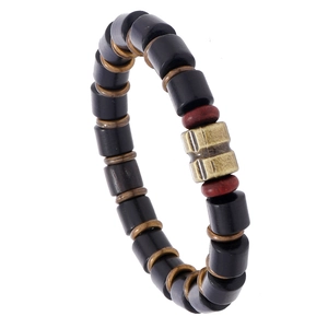 Men's retro black wooden beaded bracelet with bronze textured metal charms on white background